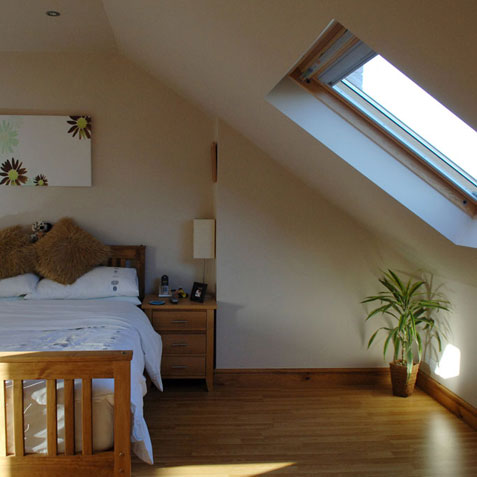 Loft conversion bedroom with velux windows